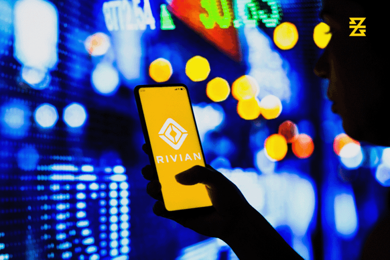 Rivian IPO displayed on a mobile device held by financial trader with rising prices near a baxia markets time symbol.